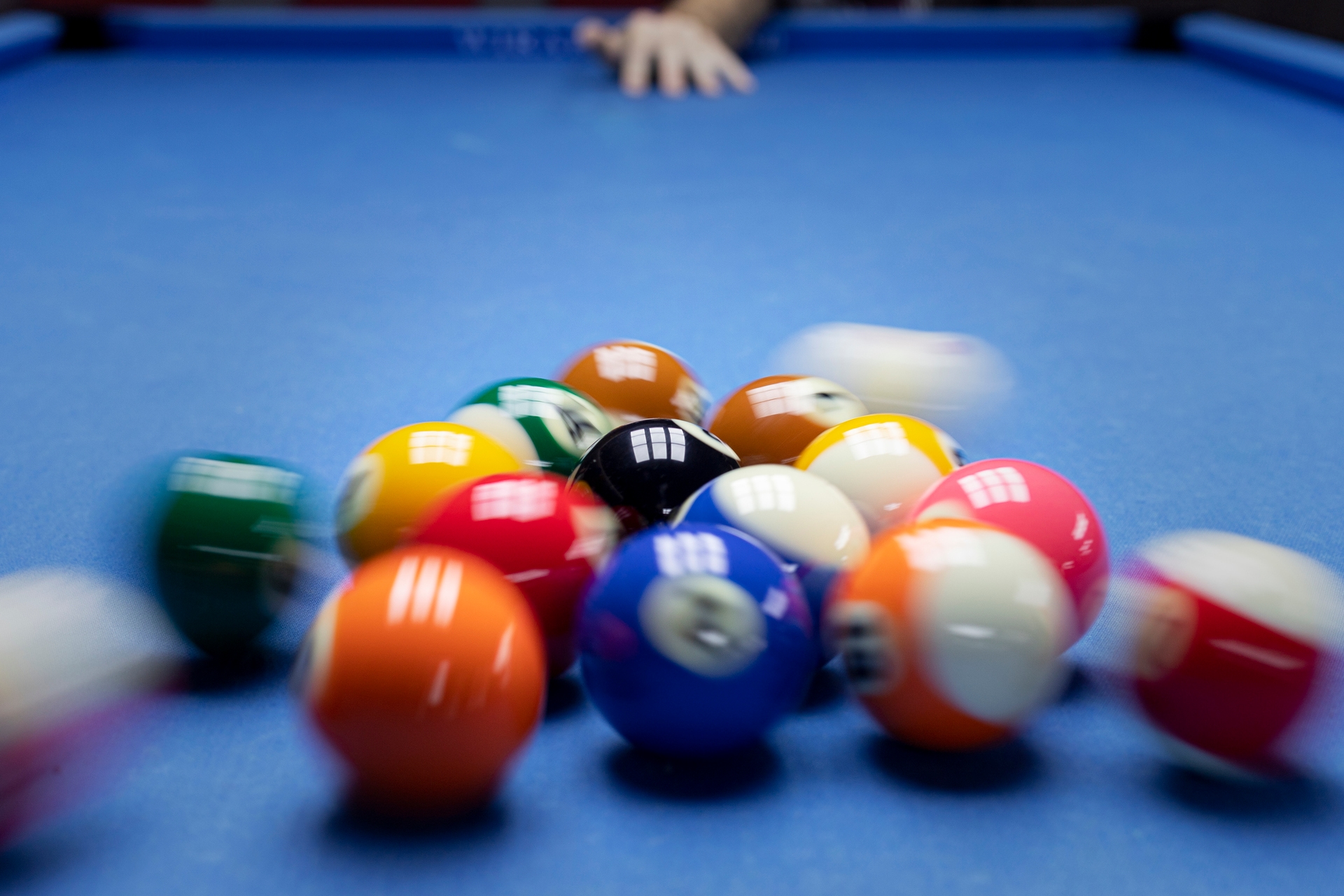 breaking of pool balls on a pool table