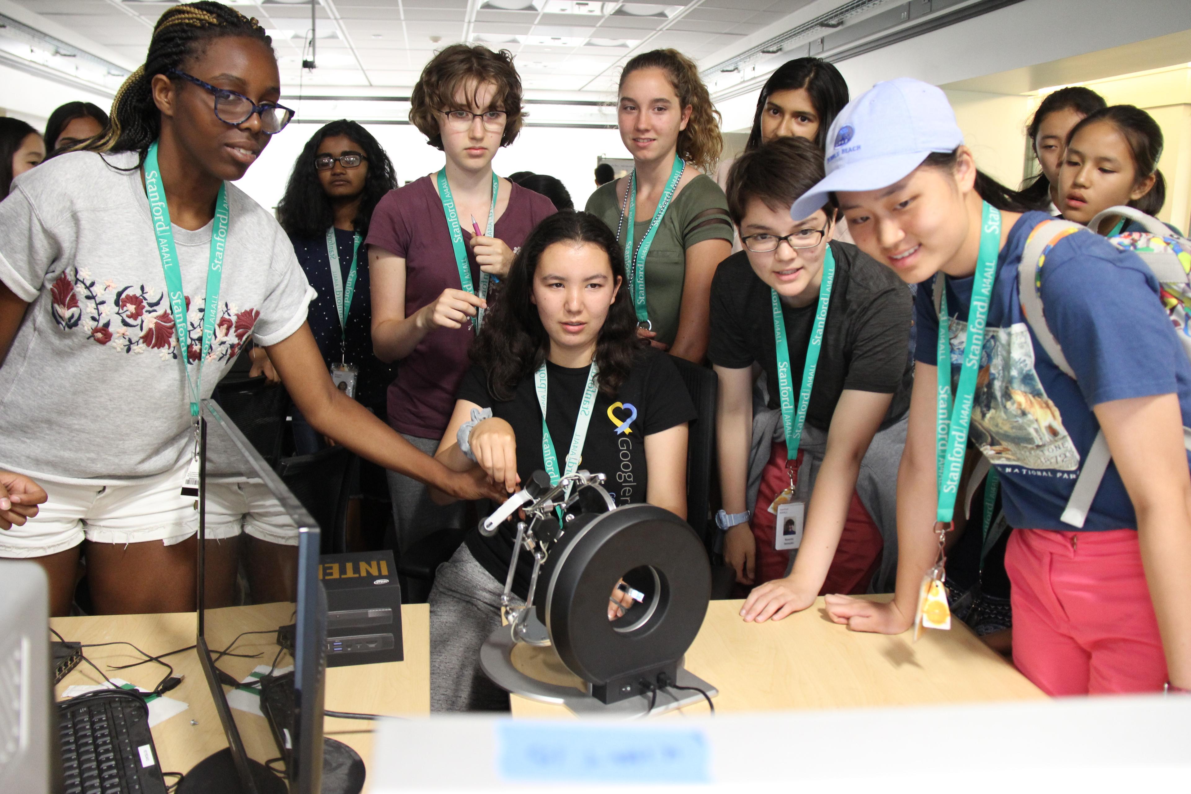 Grade-school students using a haptic device