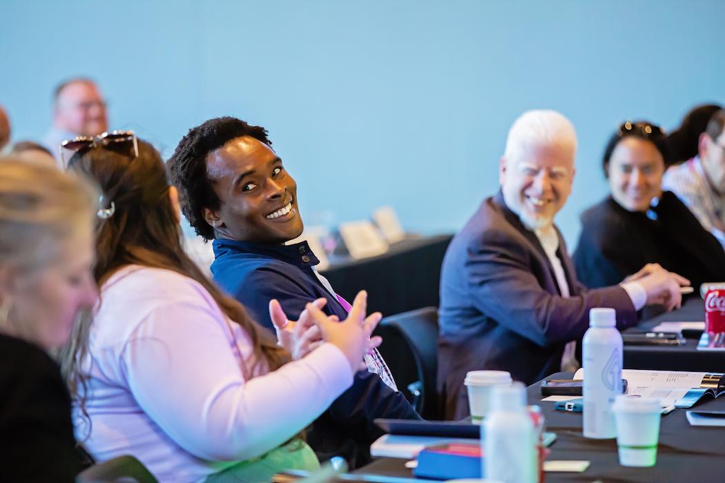 Congressional staffers smiling while in a Boot Camp session