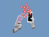 illustration of hands holding cell phones with social media hearts emerging