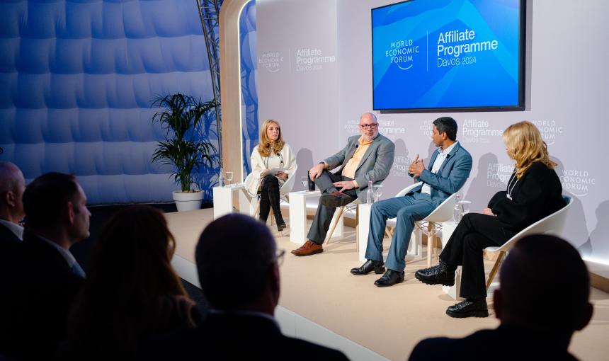 James Landay, second from left, on a stage for a panel discussion in Davos