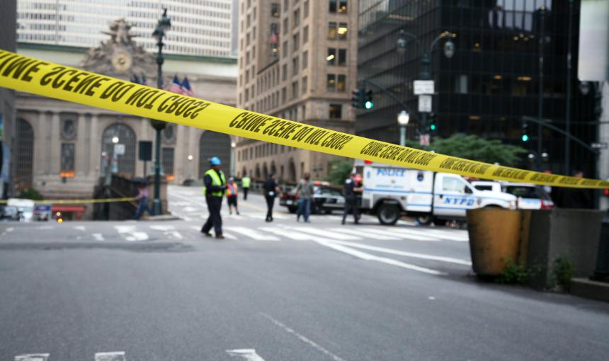Police crime scene tape cuts off the street in New York City