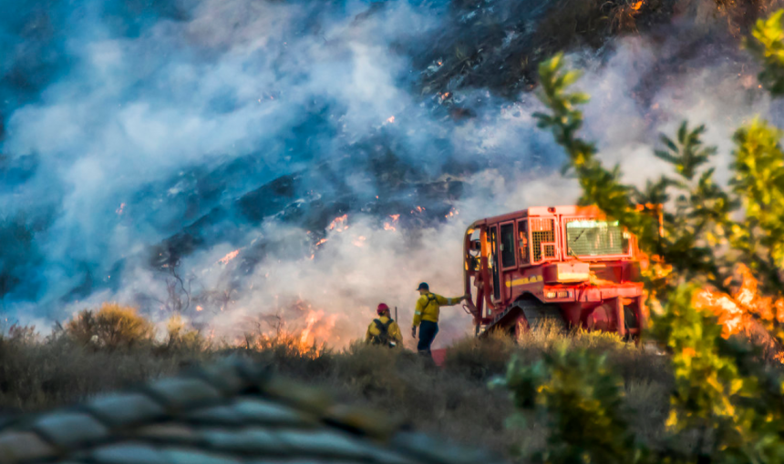 Image of firefighters battling a wildfire