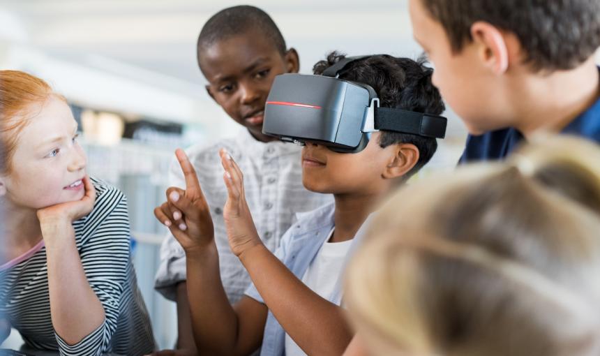 Grade-school children in the classroom with VR