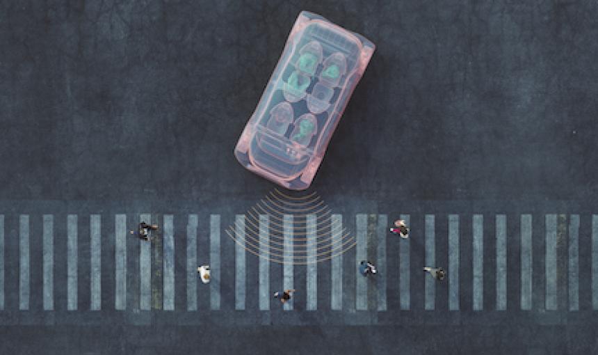 Self driving car approaches pedestrians in crosswalk