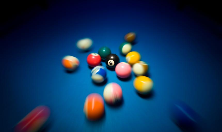 Fast moving billiard balls on blue table