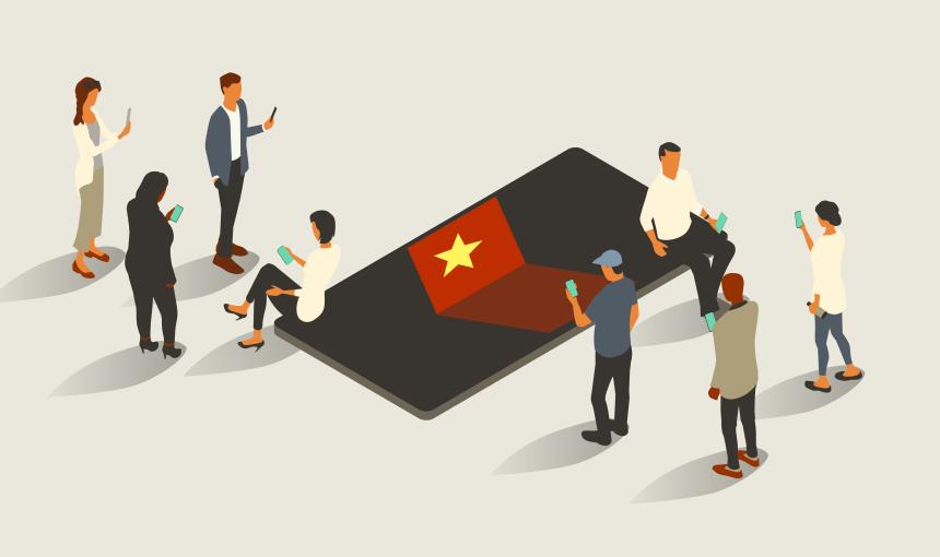Eight people surround an oversized phone with a Vietnamese flag design theme on-screen. Everyone uses mobile phones themselves. Isometric