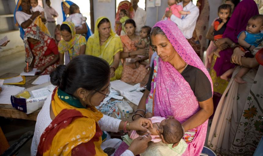 Health workers treating children