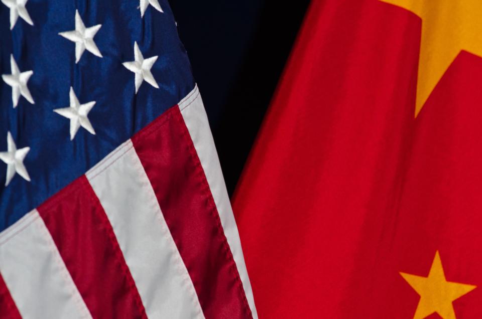 Photo of the U.S. flag next to the China flag.