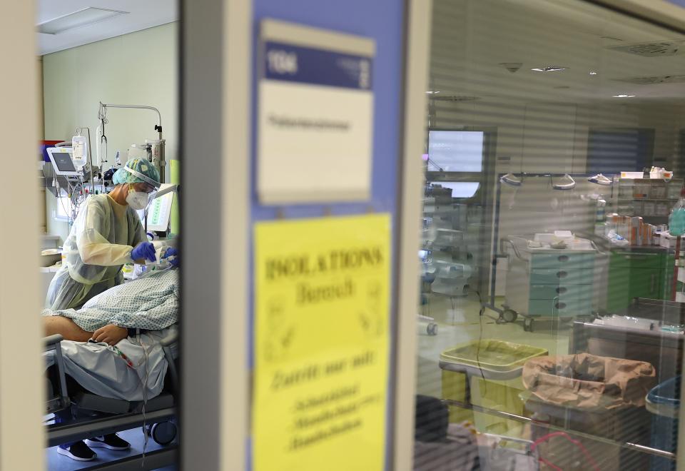 A patient suffering from COVID-19 receives treatment at the coronavirus disease (COVID-19) Intensive Care Unit (ICU) of the "Klinikum Darmstadt" clinic in Darmstadt, Germany, May 20, 2021.