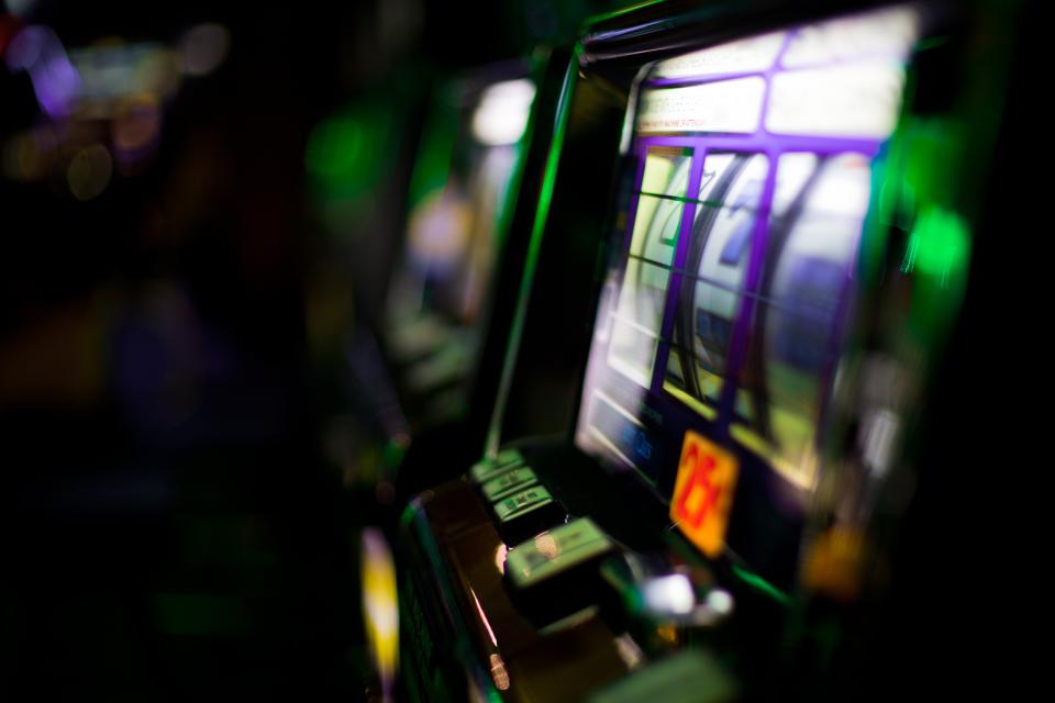 Shallow focus shot of slot machines at a casino.