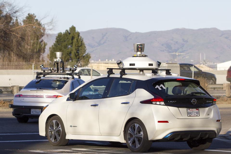 Autonomous cars drive around a testing area