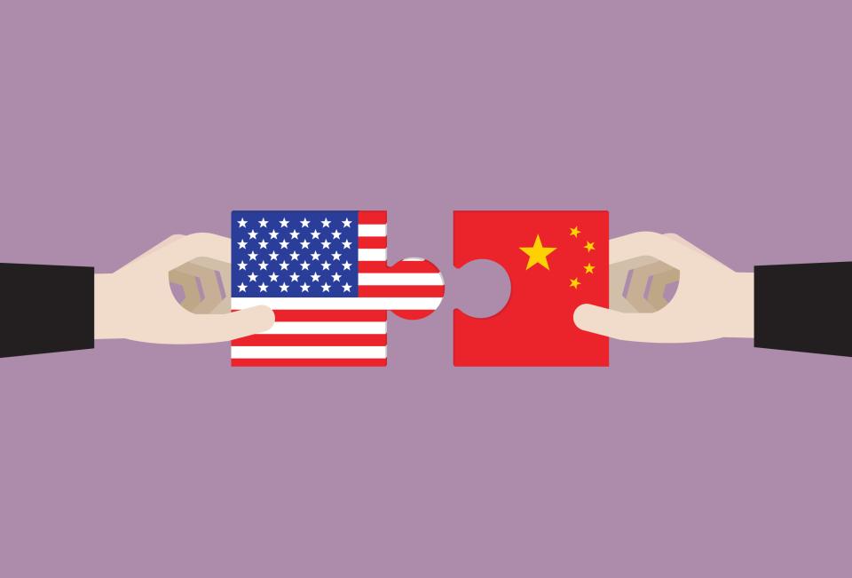 illustration of two puzzle pieces joining, one with the U.S. flag and one with the China flag.