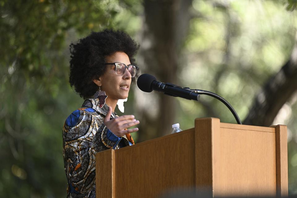 Timnit Gebru speaks from a podium during a recent Stanford event.