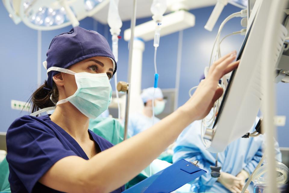 Doctor working with technology in operating room