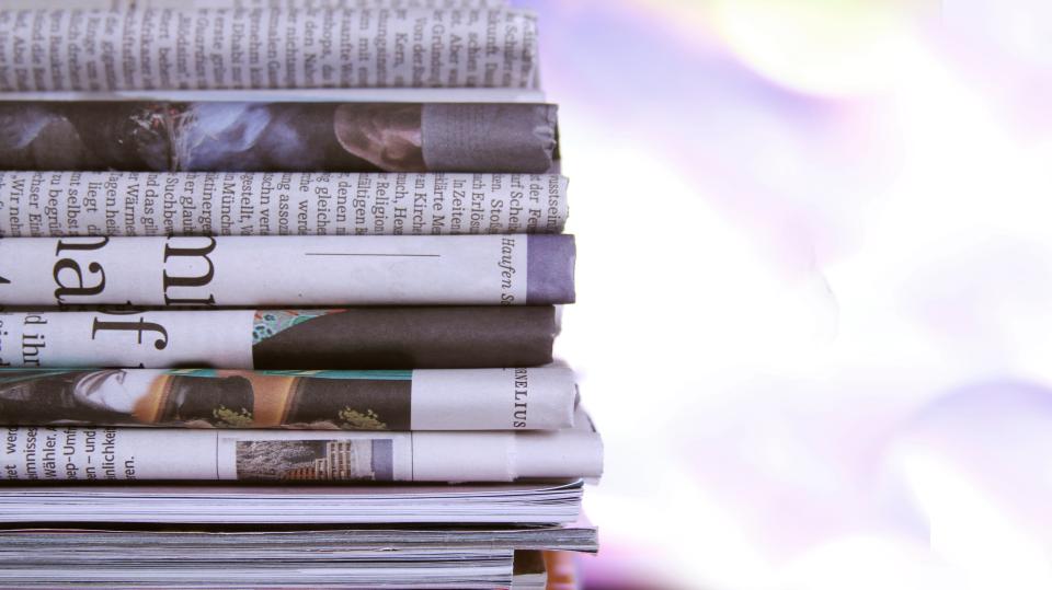 Photo of newspapers stacked on top of each other