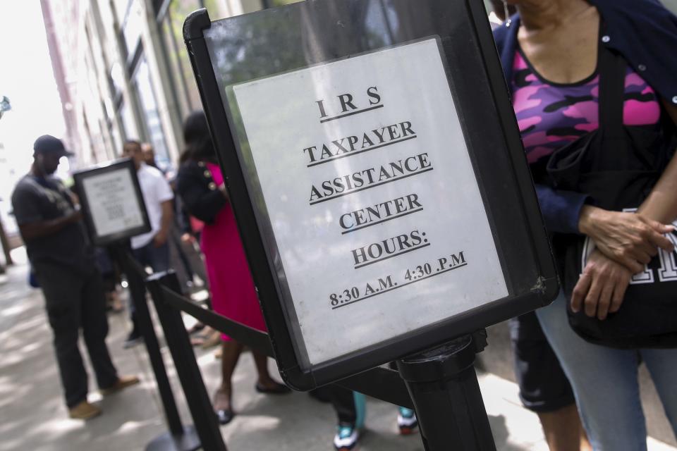 Photo of a line outside an IRS building offering free tax assistance