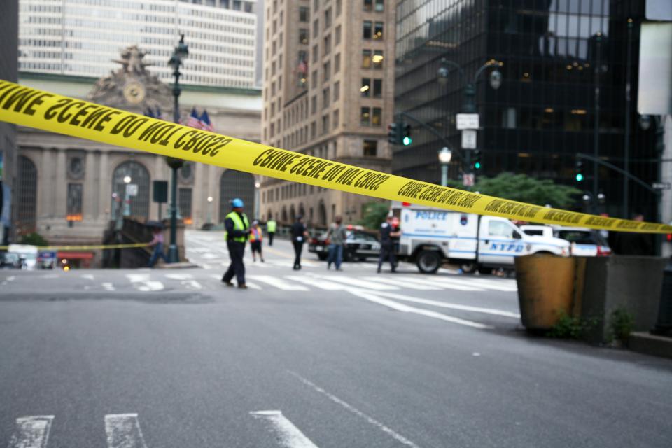 Police crime scene tape cuts off the street in New York City