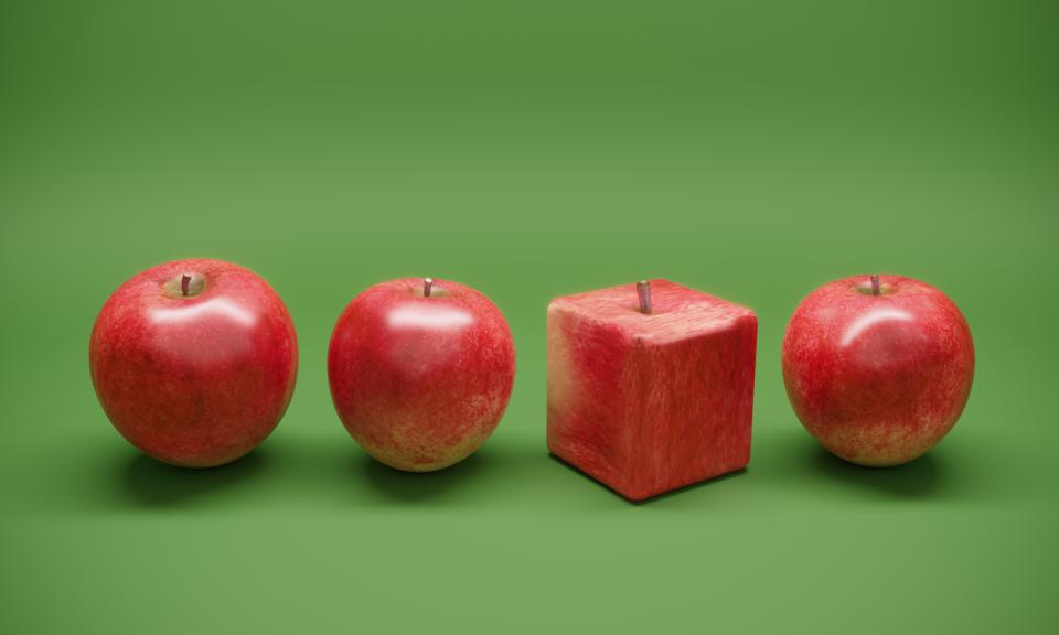 Cube shaped apple between the normal apples.