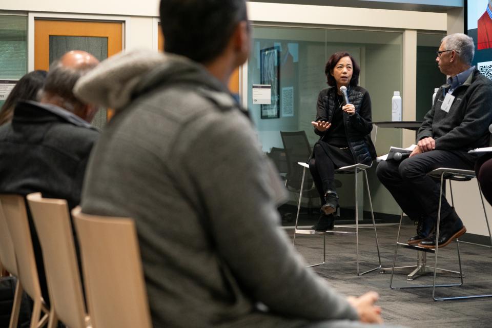 Fei-Fei Li speaks on a panel discussion at a recent HAI event. 