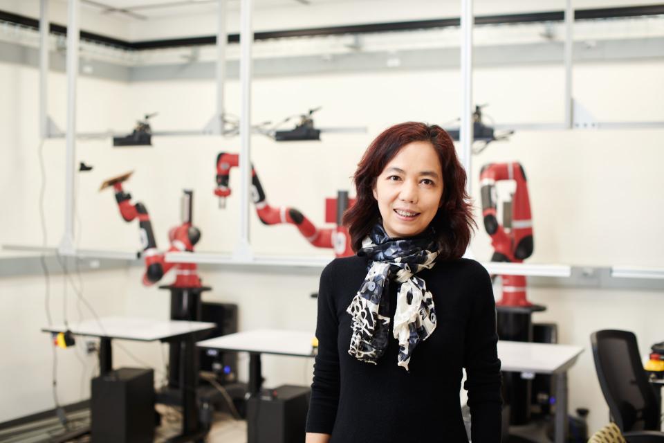 Fei-Fei Li in a robotics lab
