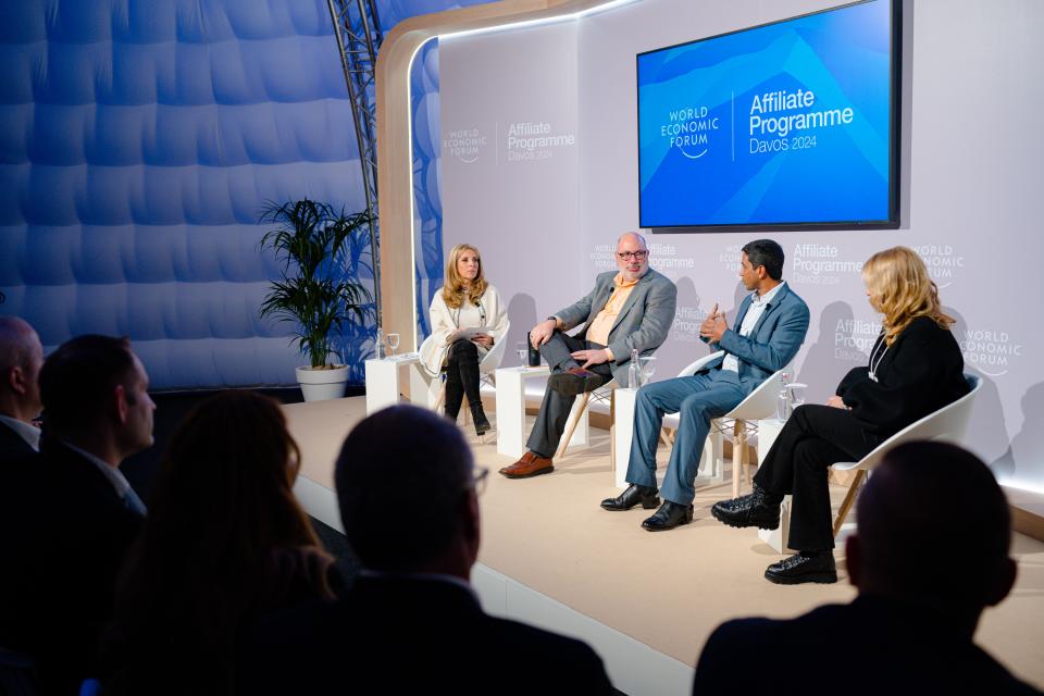 James Landay, second from left, on a stage for a panel discussion in Davos