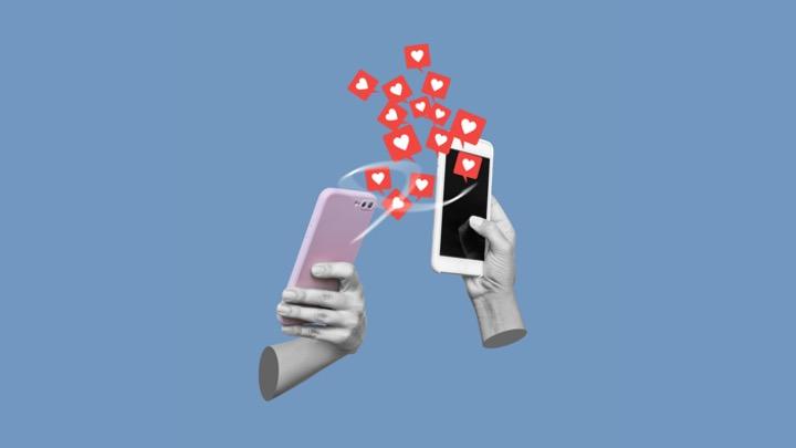 illustration of hands holding cell phones with social media hearts emerging