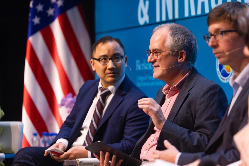 Dan Ho, left, and Chris Manning at a panel discussion